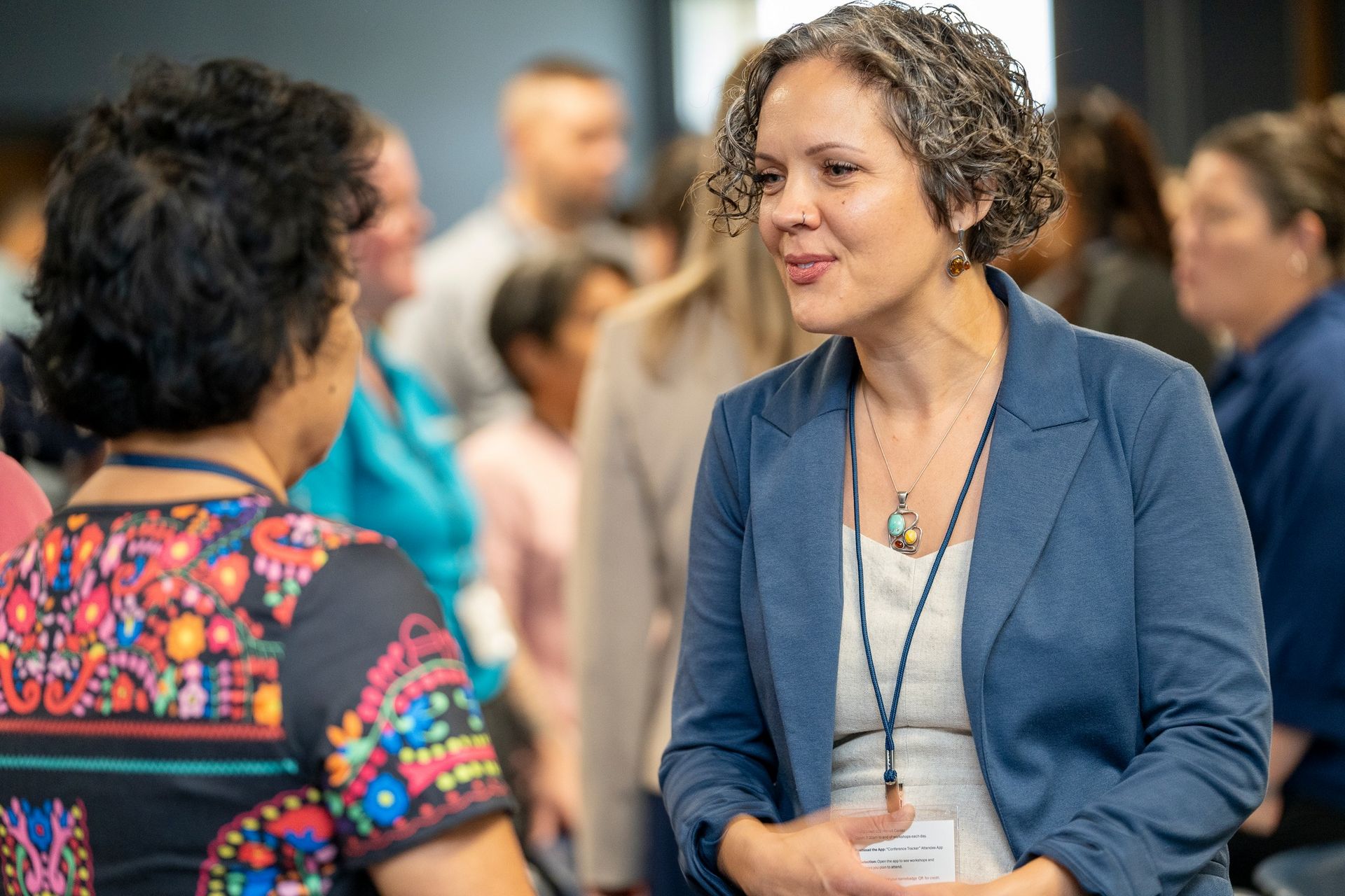 Lydia speaking with attendee at NC conference-2024